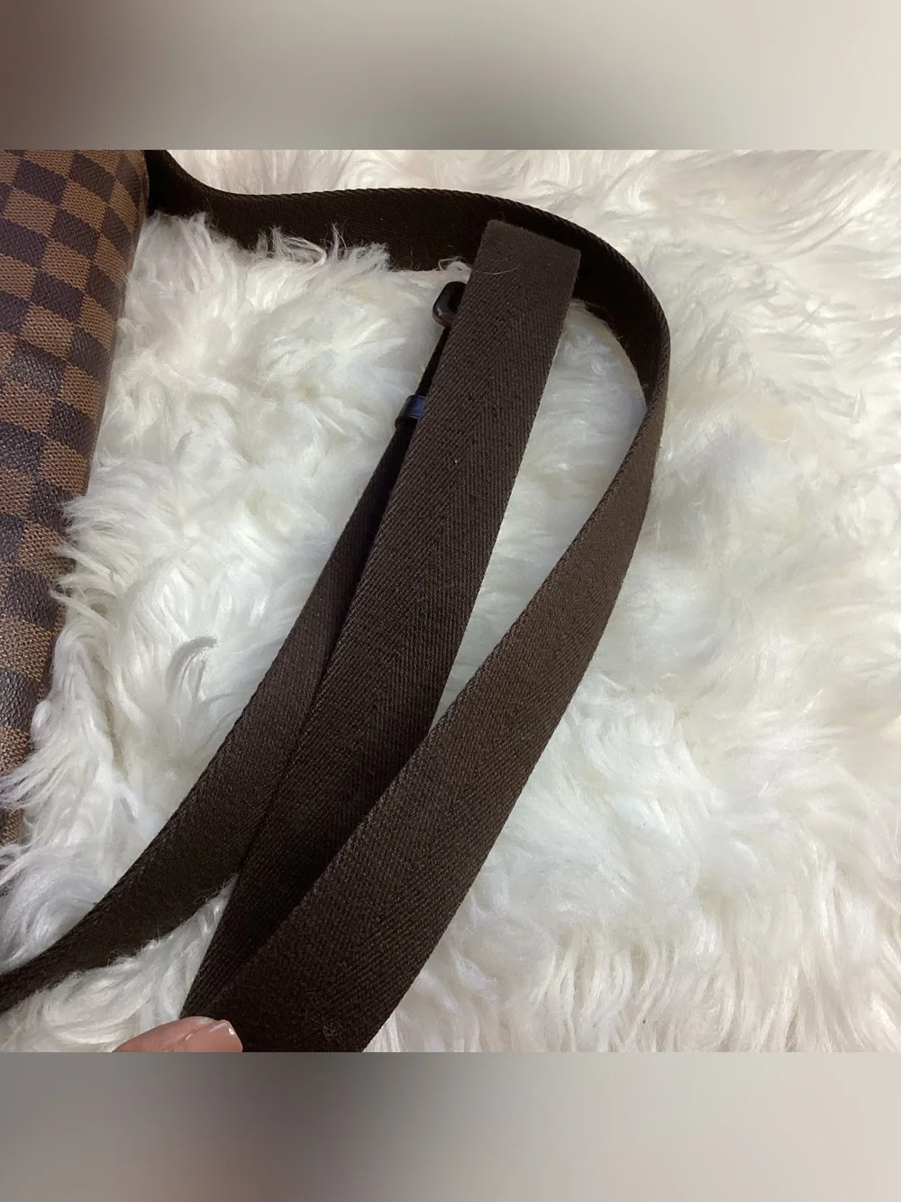 Louis Vuitton Damier Ebene District MM messenger bag.